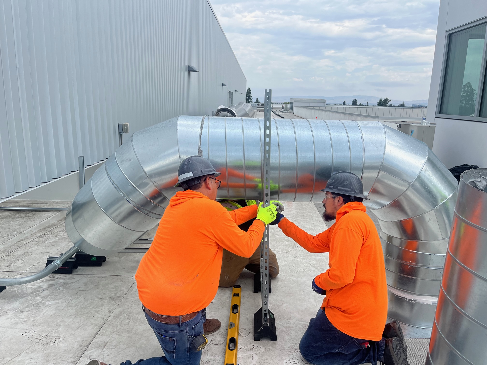 Technicians are installing HVAC system.